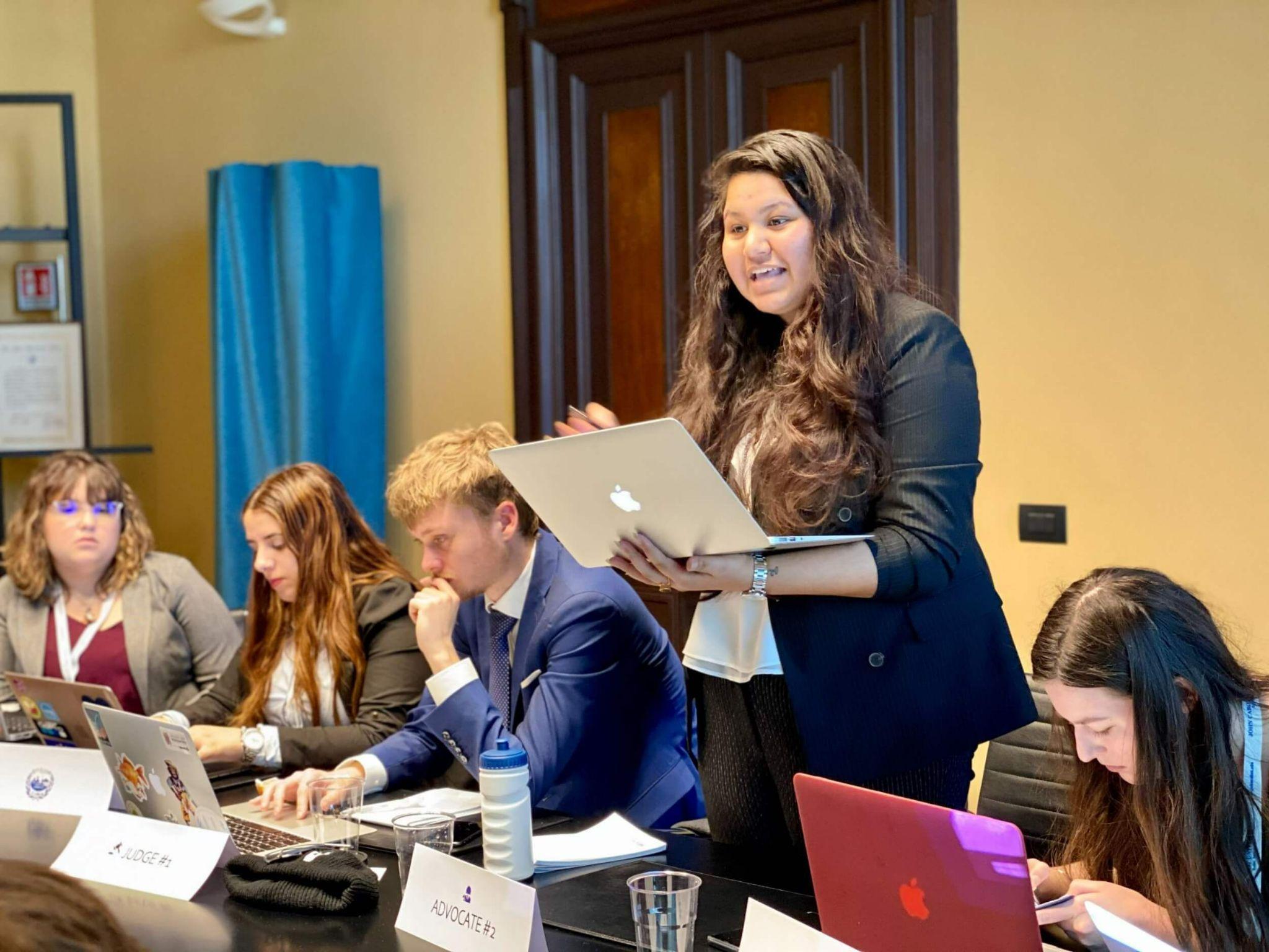 student addressing their class as they study communications in Rome