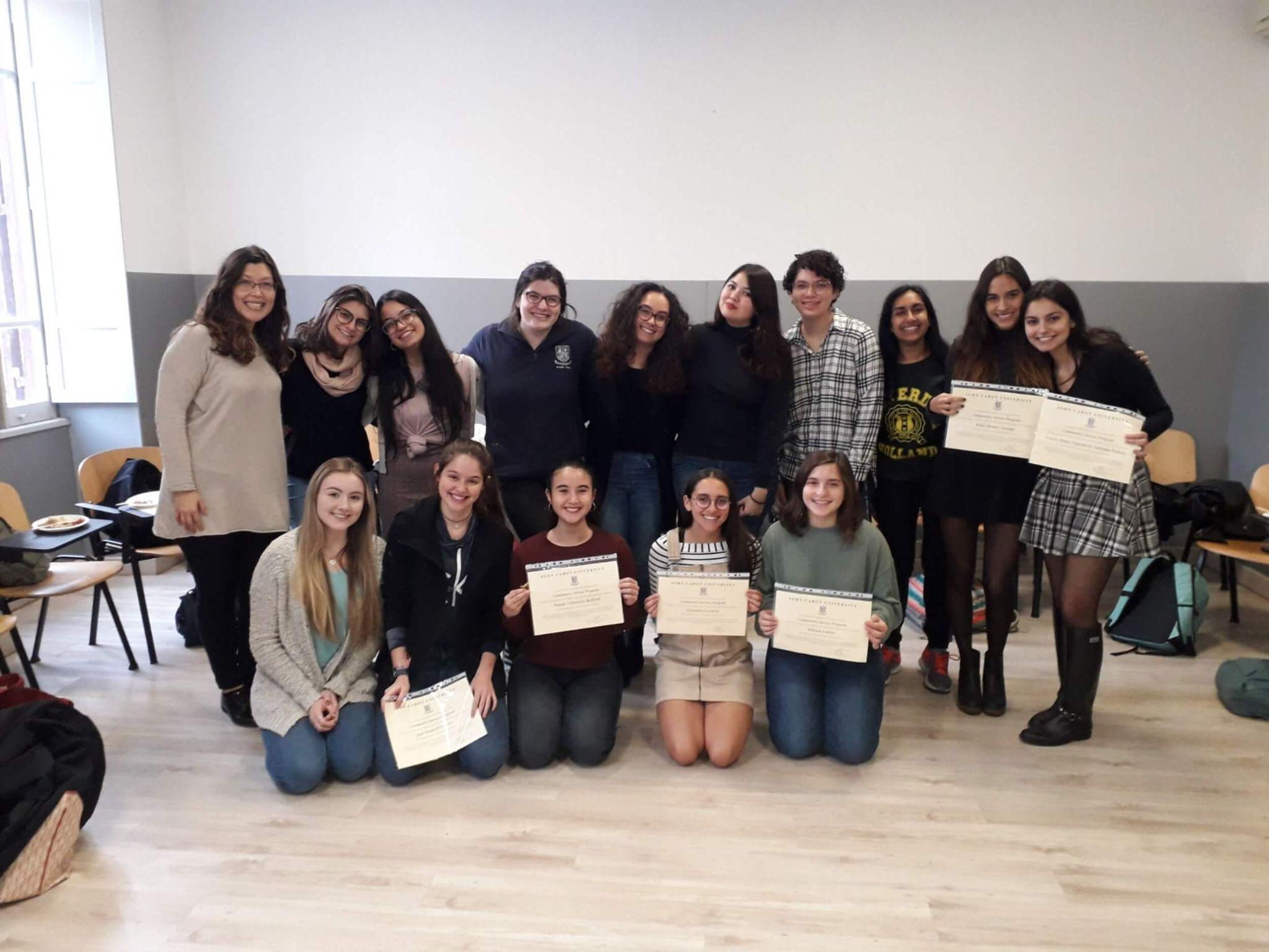students displaying their certificates of participation as they study abroad in Rome
