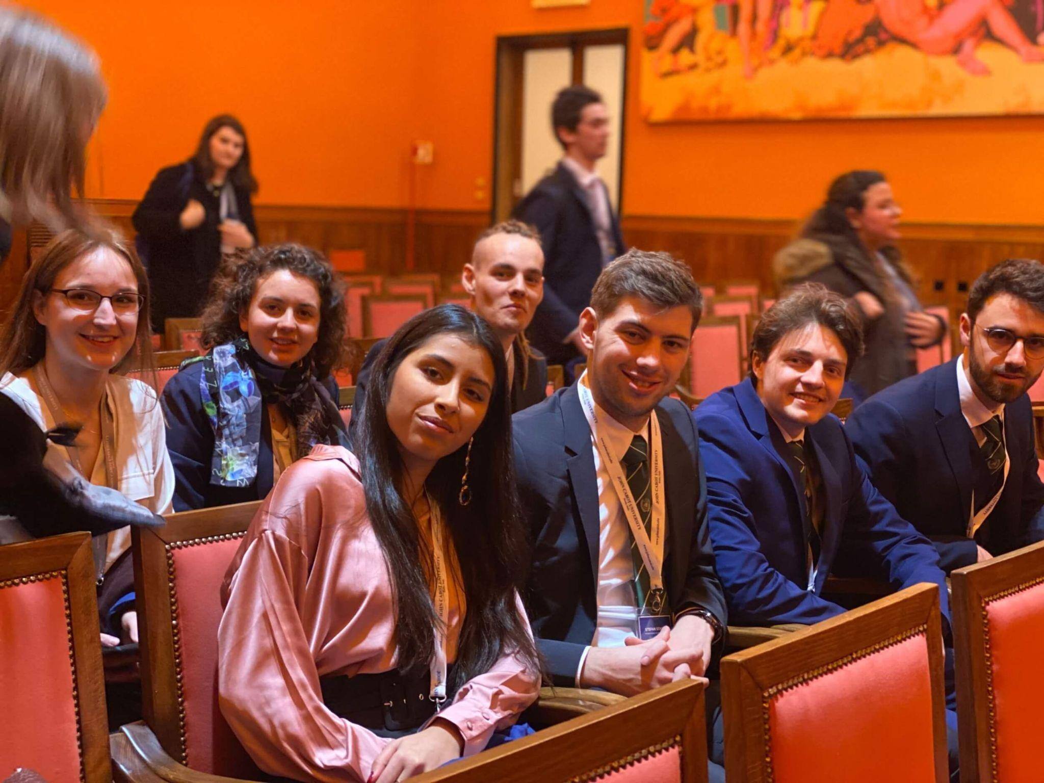 A row of students at AACSB accredited business school listening to a lecture