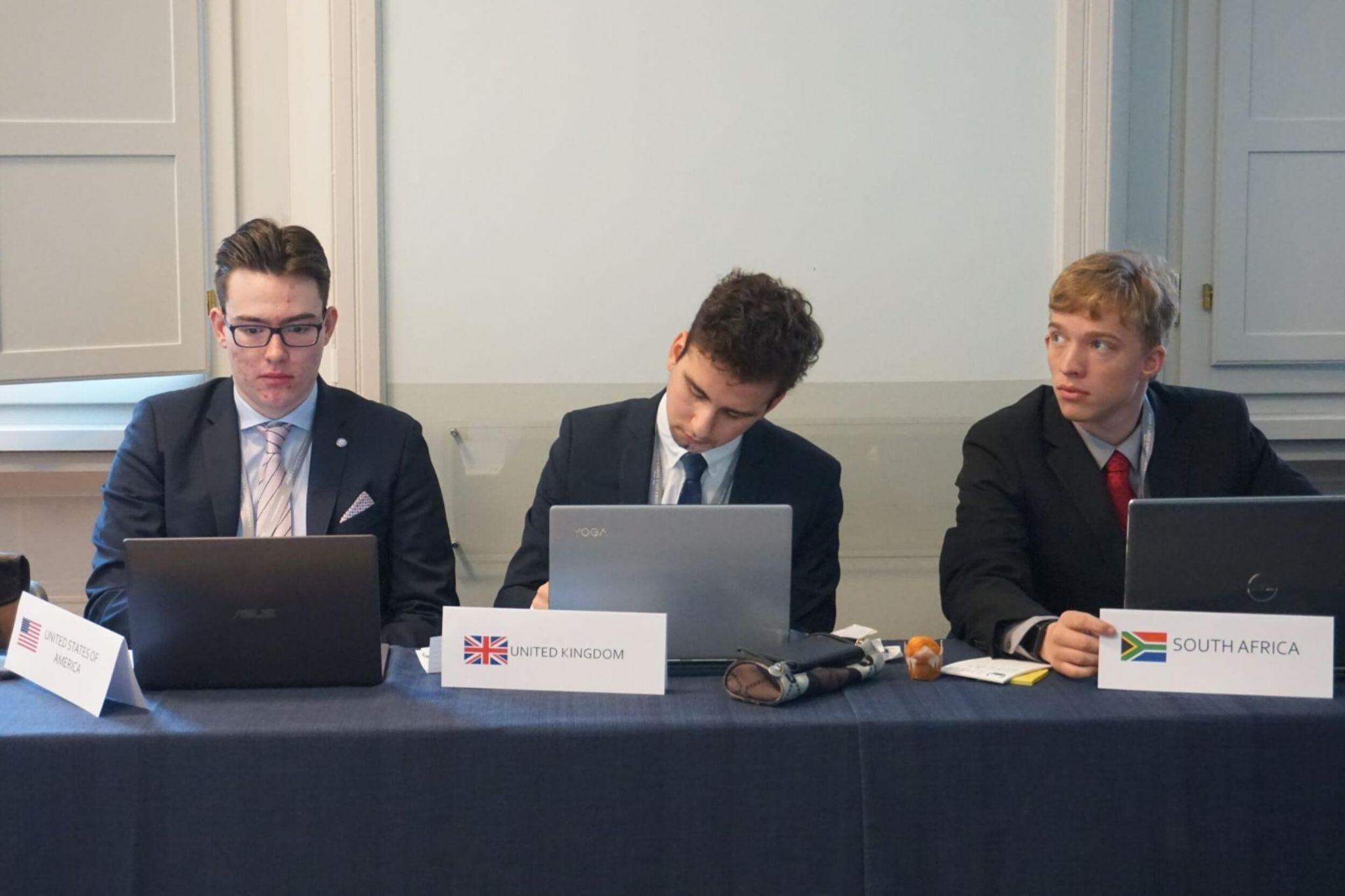 A group of business students at a university in Rome participating in an international panel activity