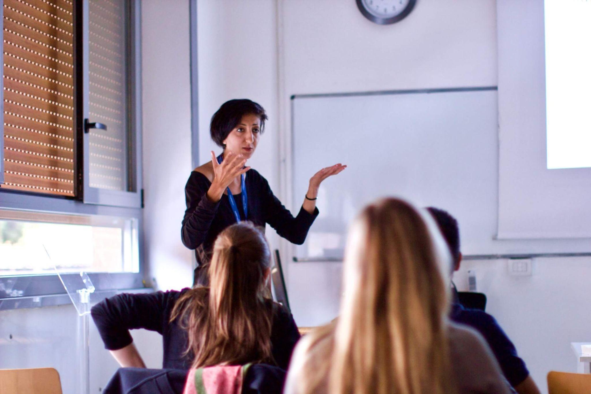 A JCU professor teaching students as they study entrepreneurship in Rome.