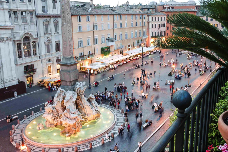A twilight view of the Fountain of Four Rivers, The Creation of Adam by Michelangelo on the Sistine Chapel ceiling, 4 Must-See Ancient Roman Works of Art, italian art history, study abroad in Rome, study art in Rome, fountains in rome