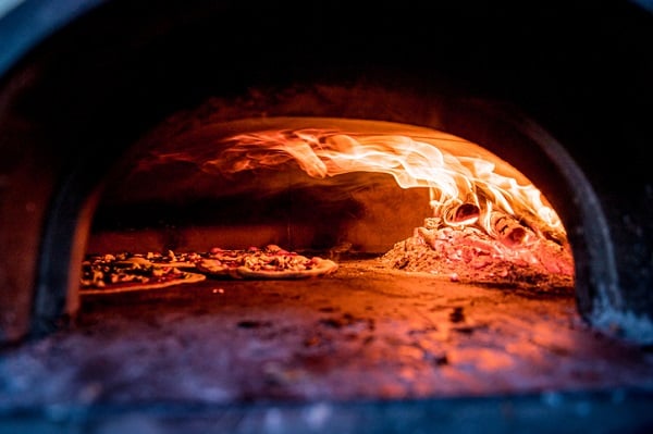 Roman-style pizza must be cooked in a wood-burning oven, to give it its distinct texture and taste