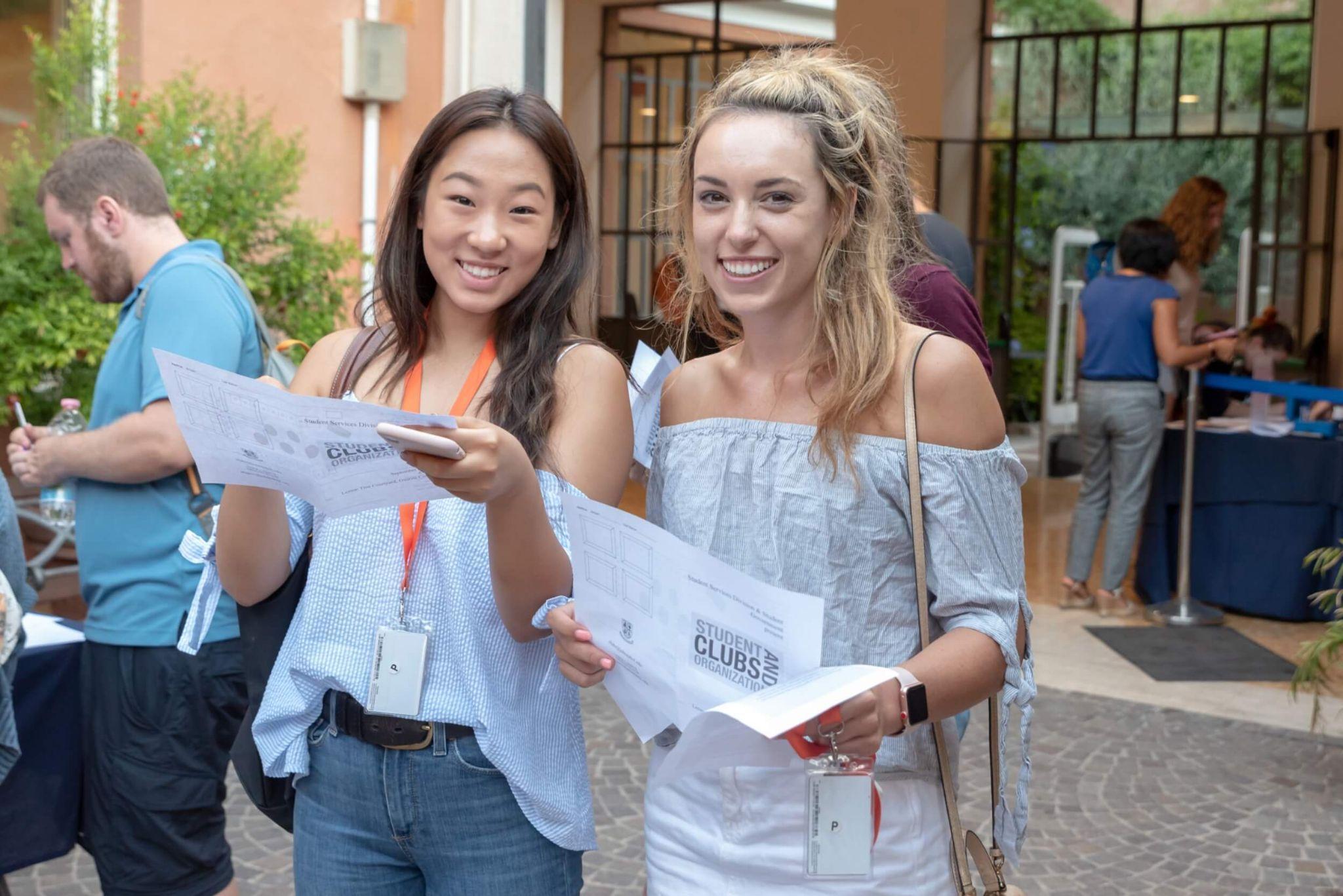 A pair of JCU students exploring the club fair.