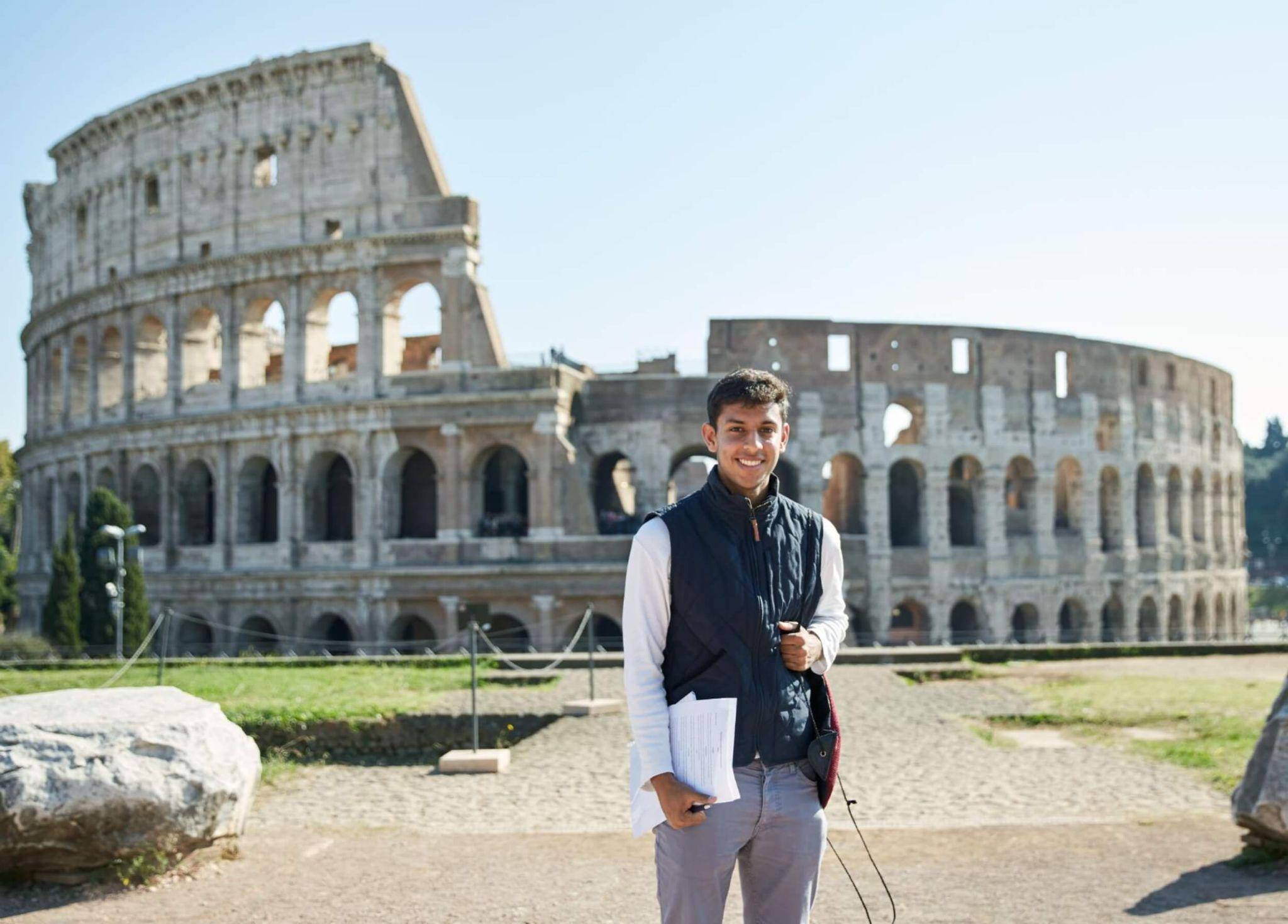 A John Cabot student standing in front of the Colosseum