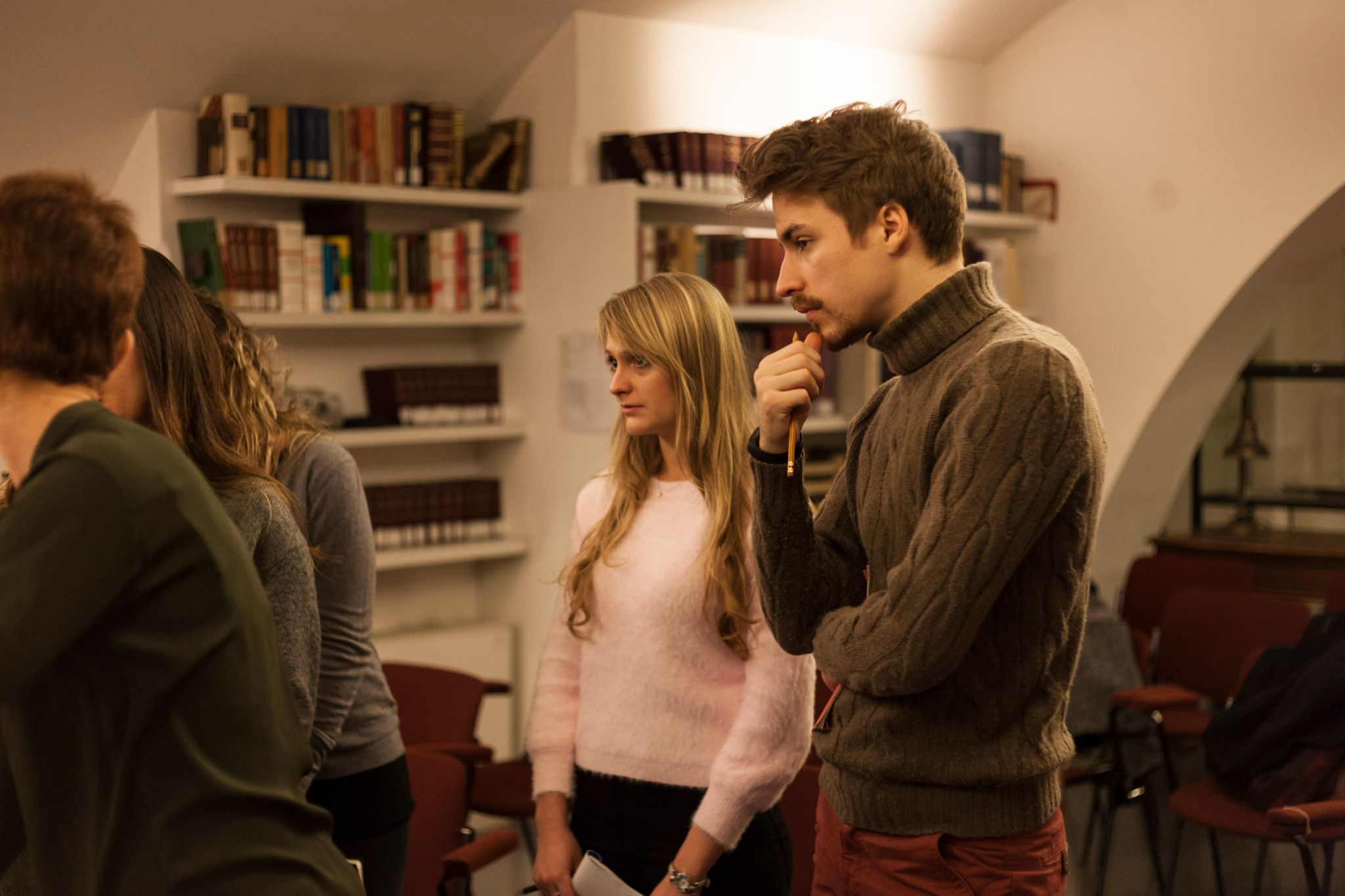 students  study art history in Rome while looking at art pensively