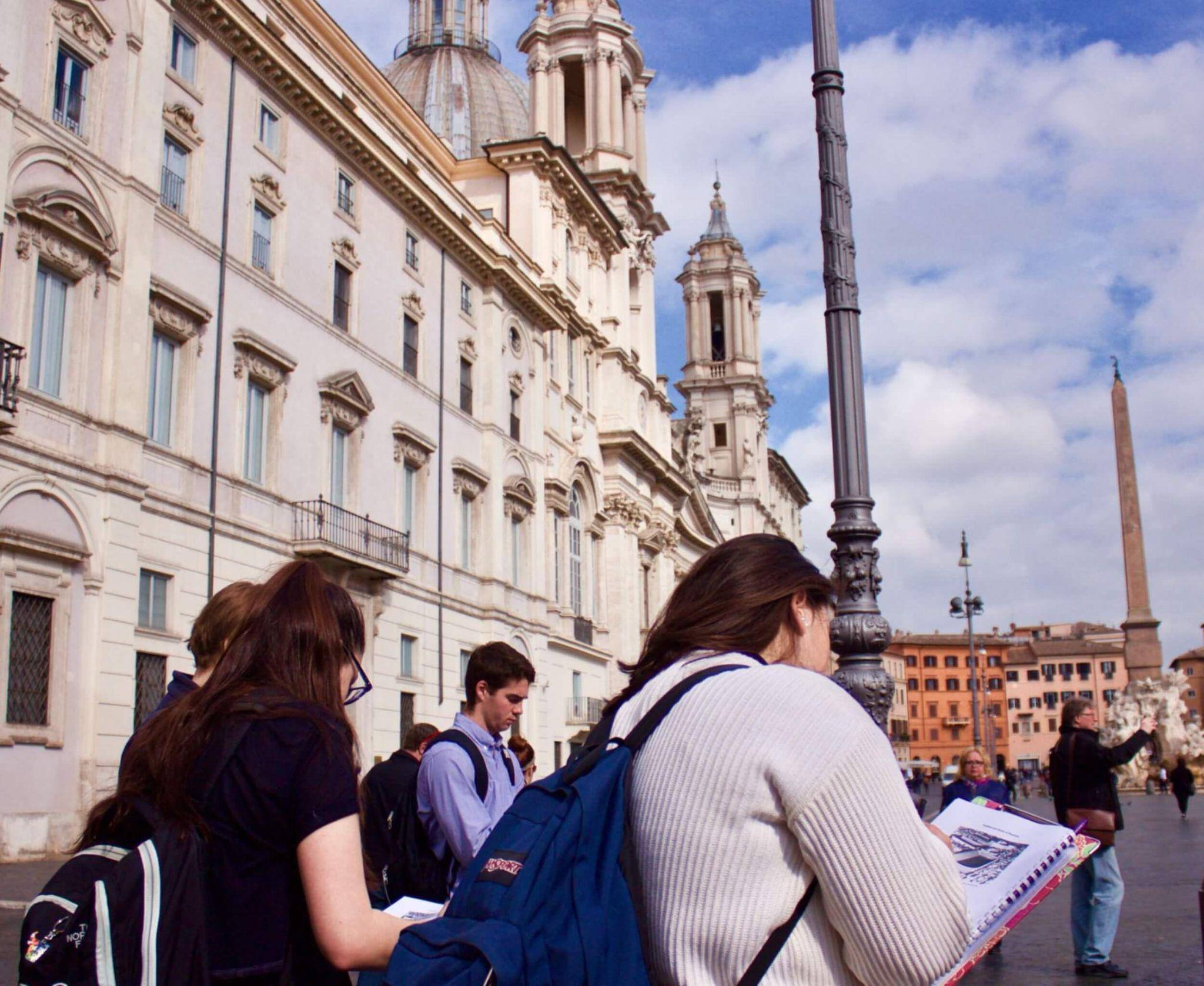 A group of art history degree seekers sketching in an onsite class