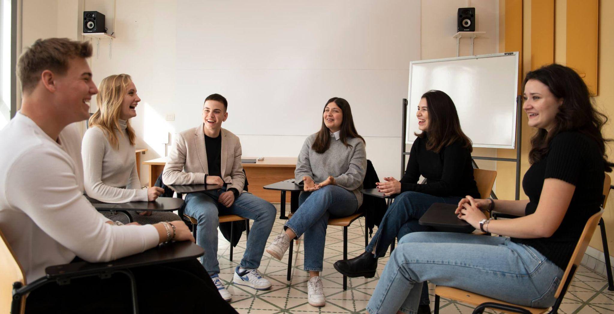 A group of students pursuing a political science education at JCU holding a group meeting