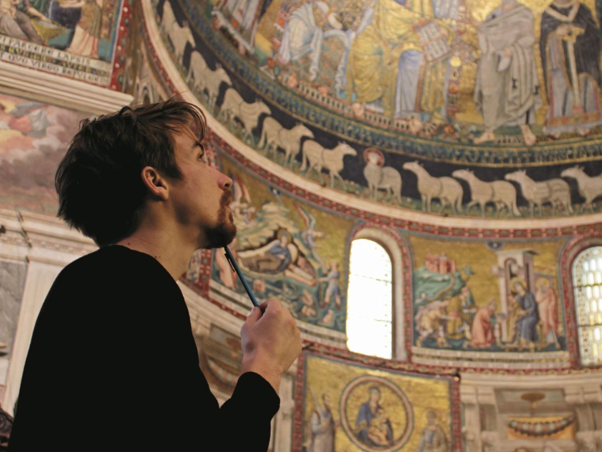 A student exploring an ornate church as they take classical studies in Rome