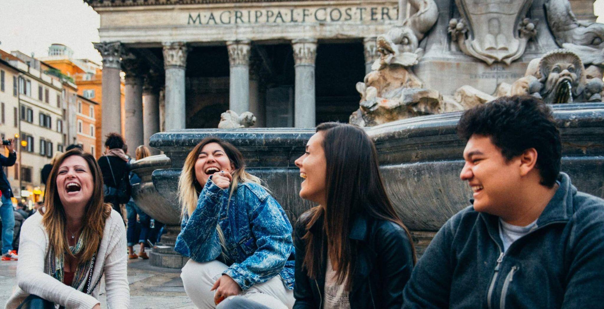 A group of JCU students studying abroad in Italy visiting a monument