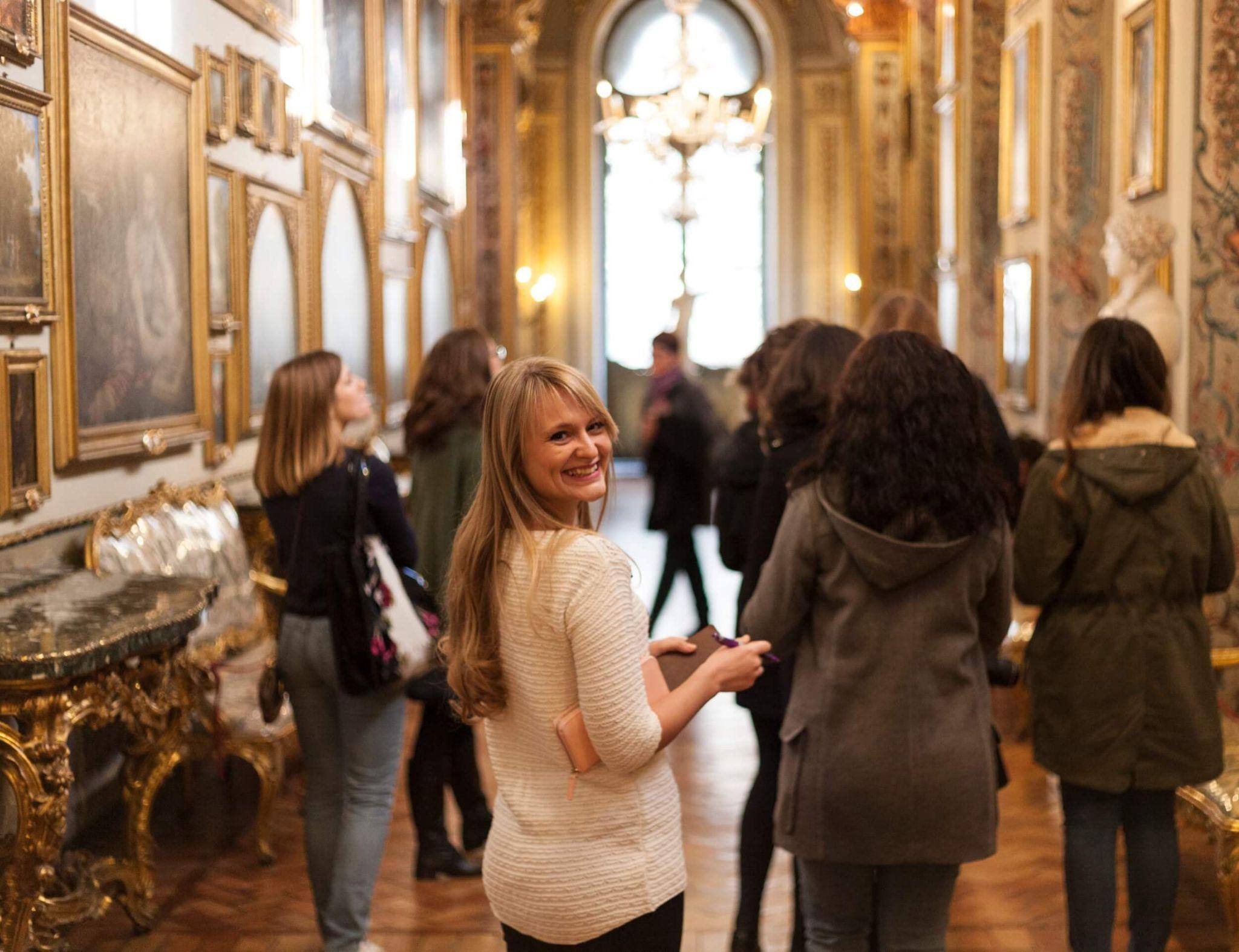 A group of study abroad students exploring an art museum