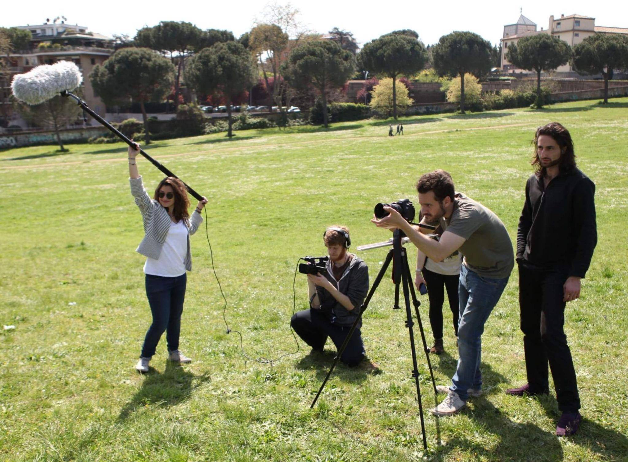 Students earning a communications degree in Rome filming a project outdoors