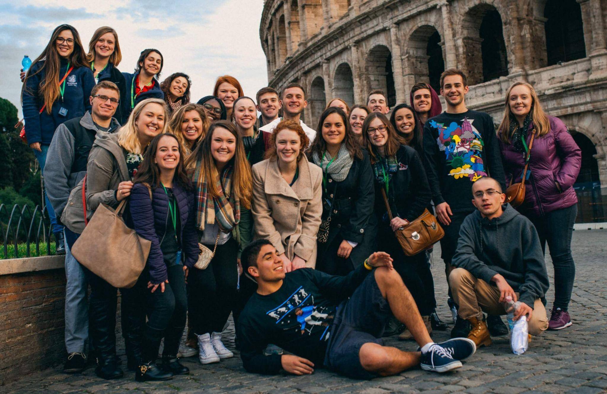 A group of students studying abroad in Italy posing for a group photograph