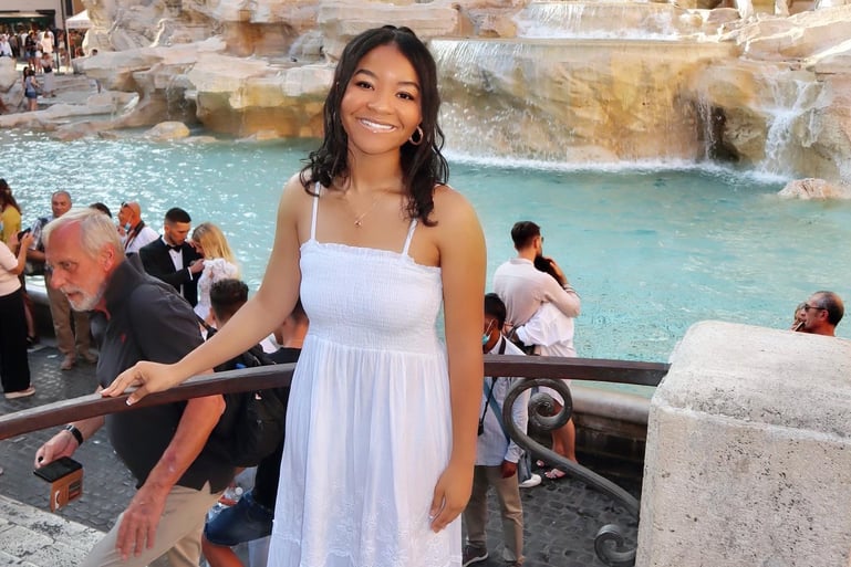 Study abroad student taking a photo in front of the Trevi fountain