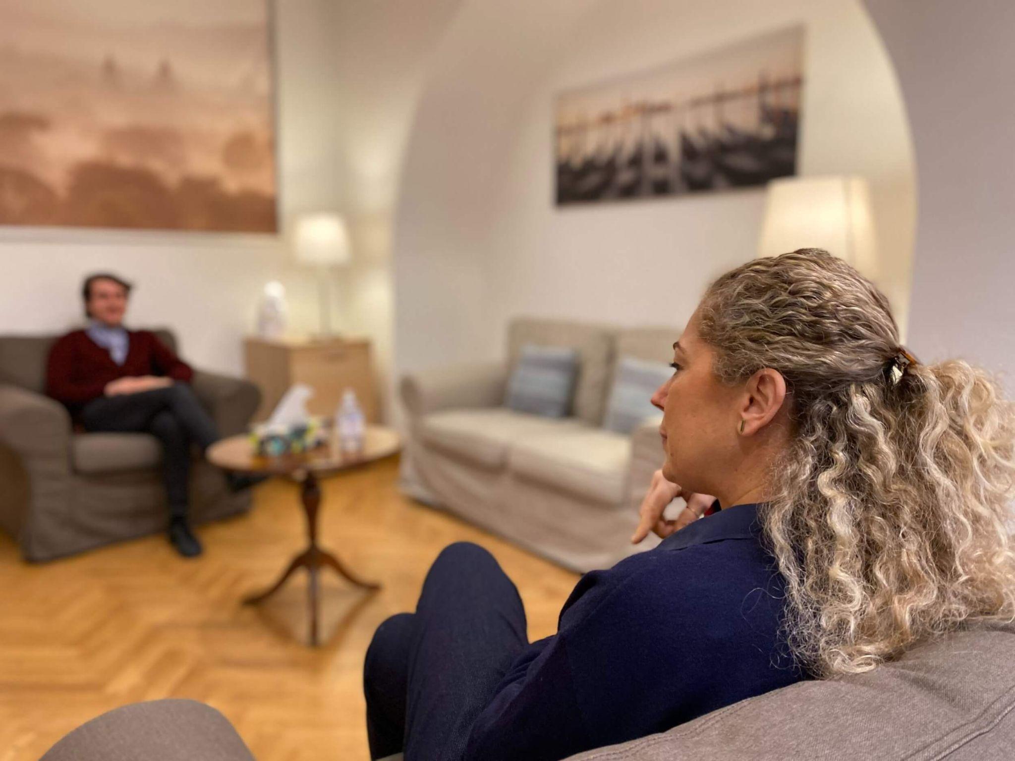 A male JCU student receiving counseling services in a counselor's office.