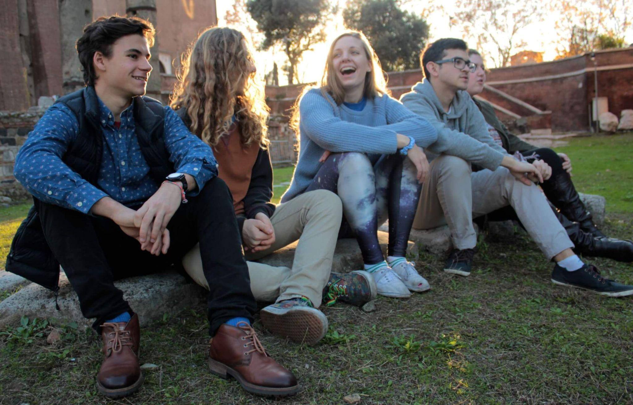 A line of JCU students sitting together on the grass