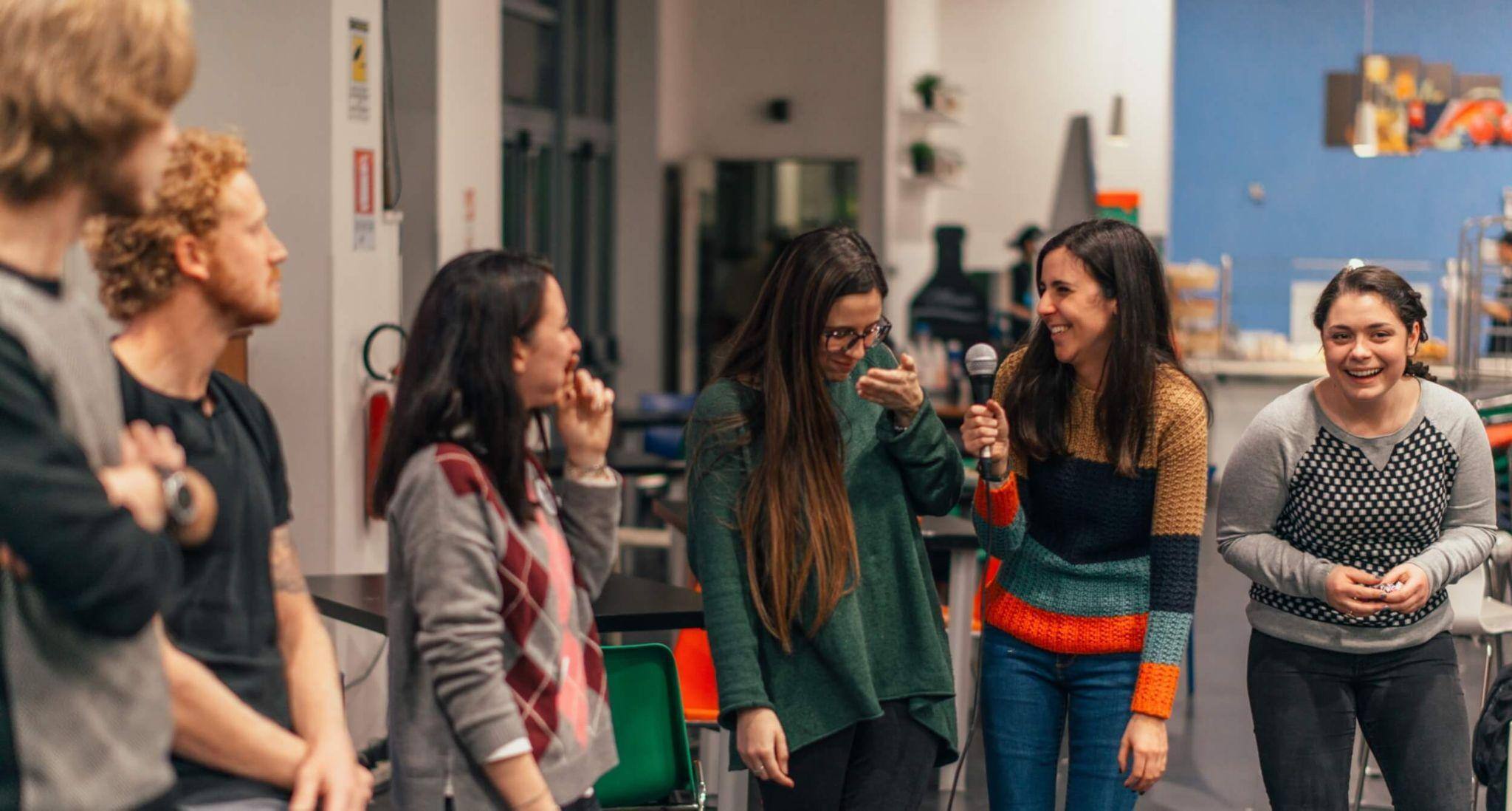 A group of smiling study abroad students on campus at our university in Italy