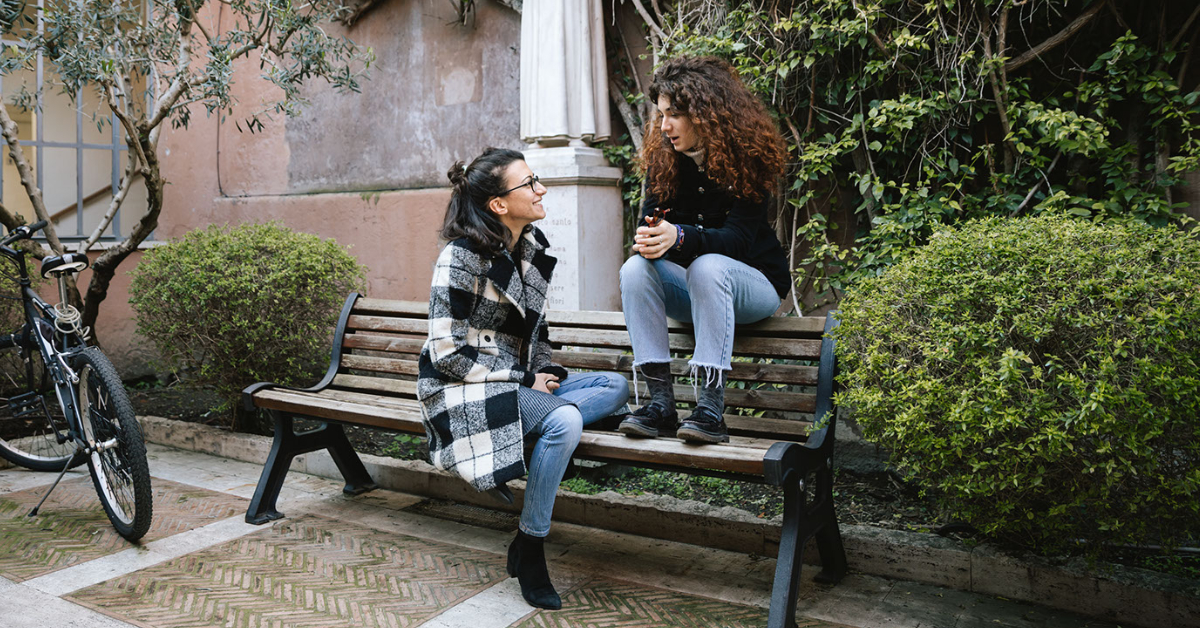 Two girls sitting on a bench