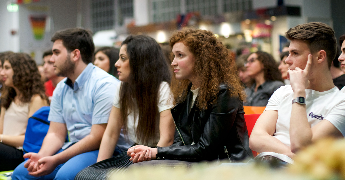 Students listening attentively during an event