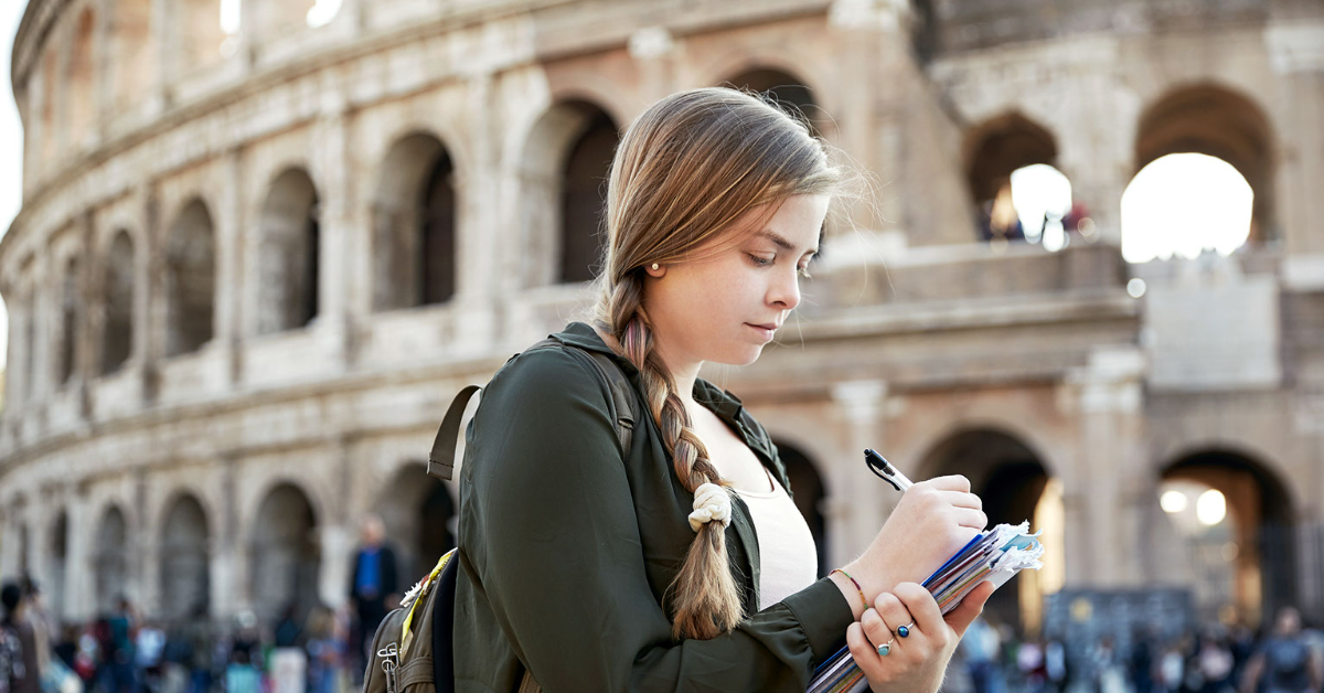 Student studying in front of the Colosseum