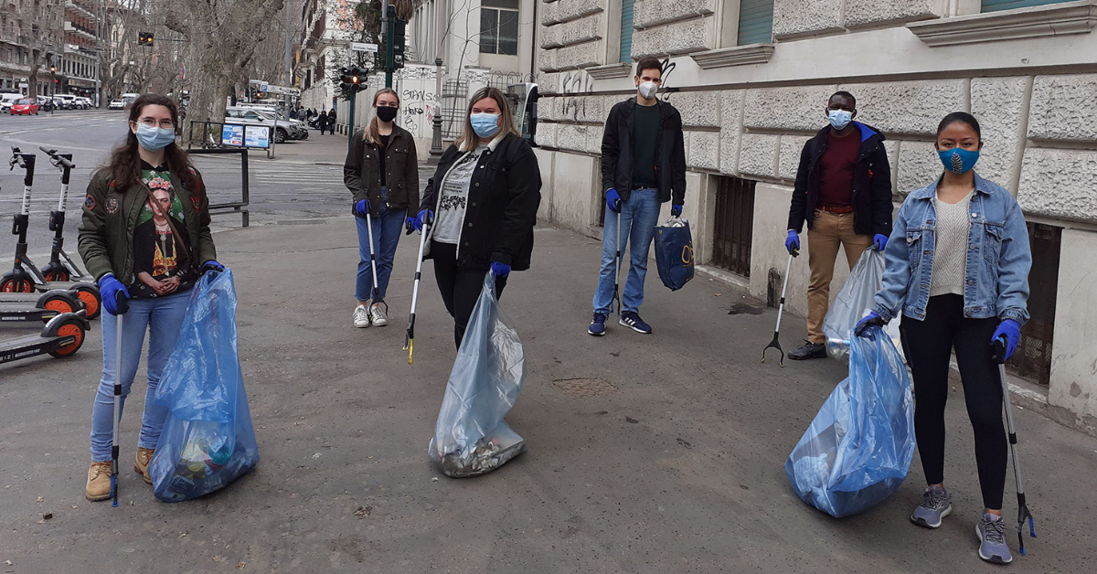 Students helping clean Trastevere picking up trash