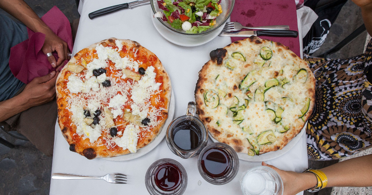 Students having pizza at an Italian restaurant in Rome