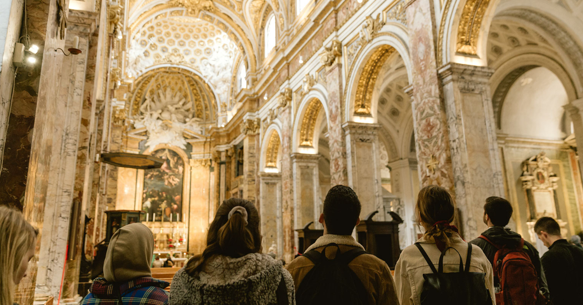 Students looking at the ceiling of one of the many churches around Rome