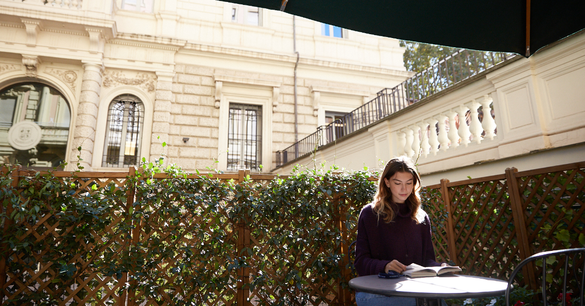 Student studying in the courtyard
