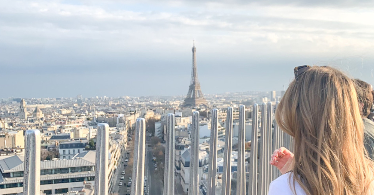 Girl with a view of the Eiffel Tower in Paris