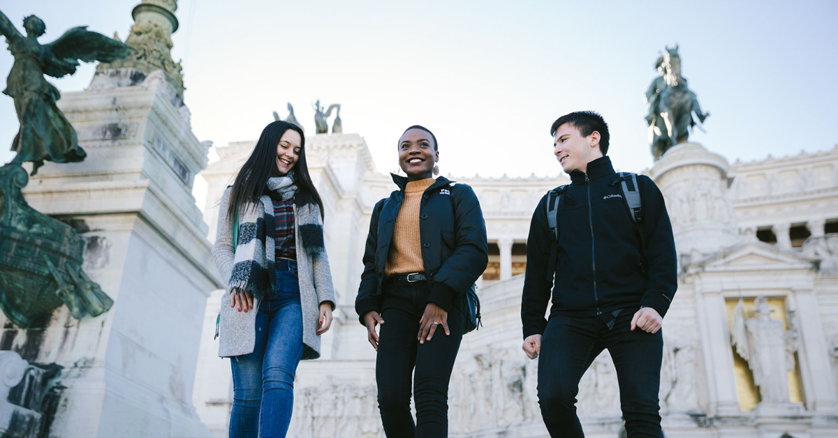 Students waling down the steps of Roman monument