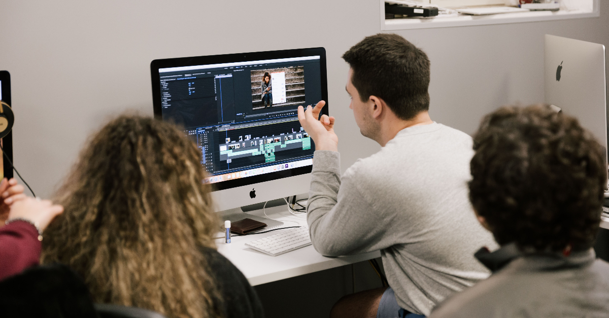 Students editing a video for a video production class