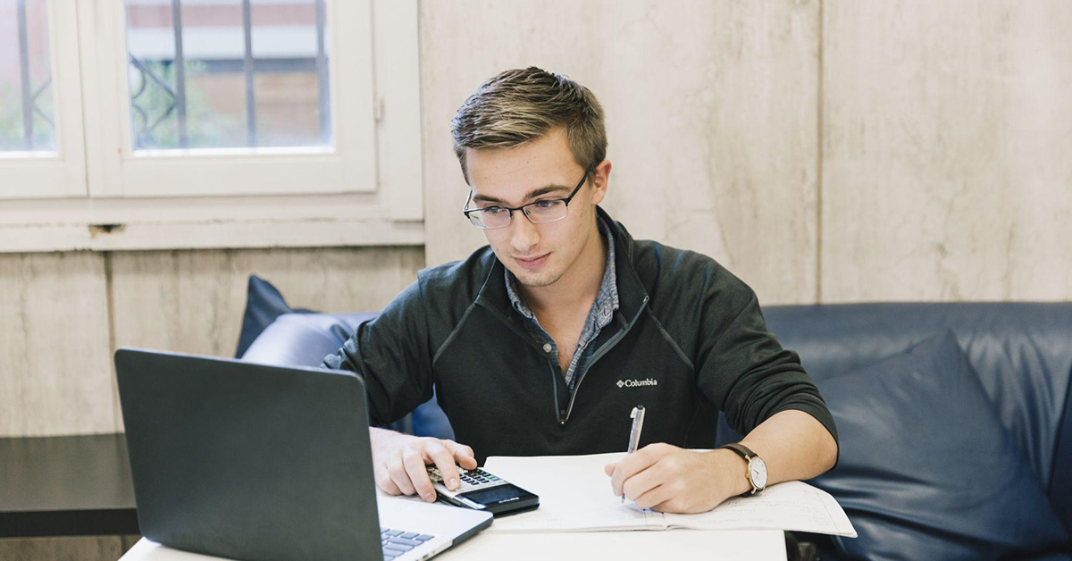 A student studying on campus