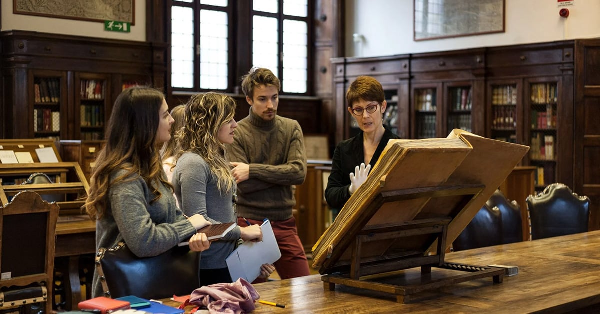 students studying art history in Rome in an ancient book store on an excursion