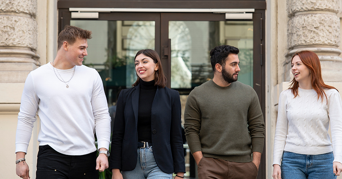 Smiling JCU students studying business