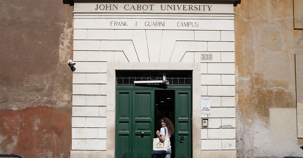 JCU student entering campus as she smiles for a photo