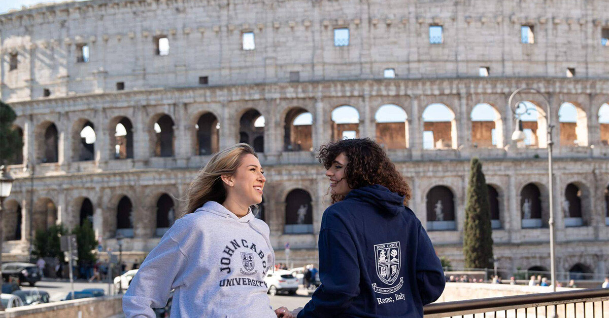 A pair of female JCU students exploring a historical monument while studying abroad in Italy