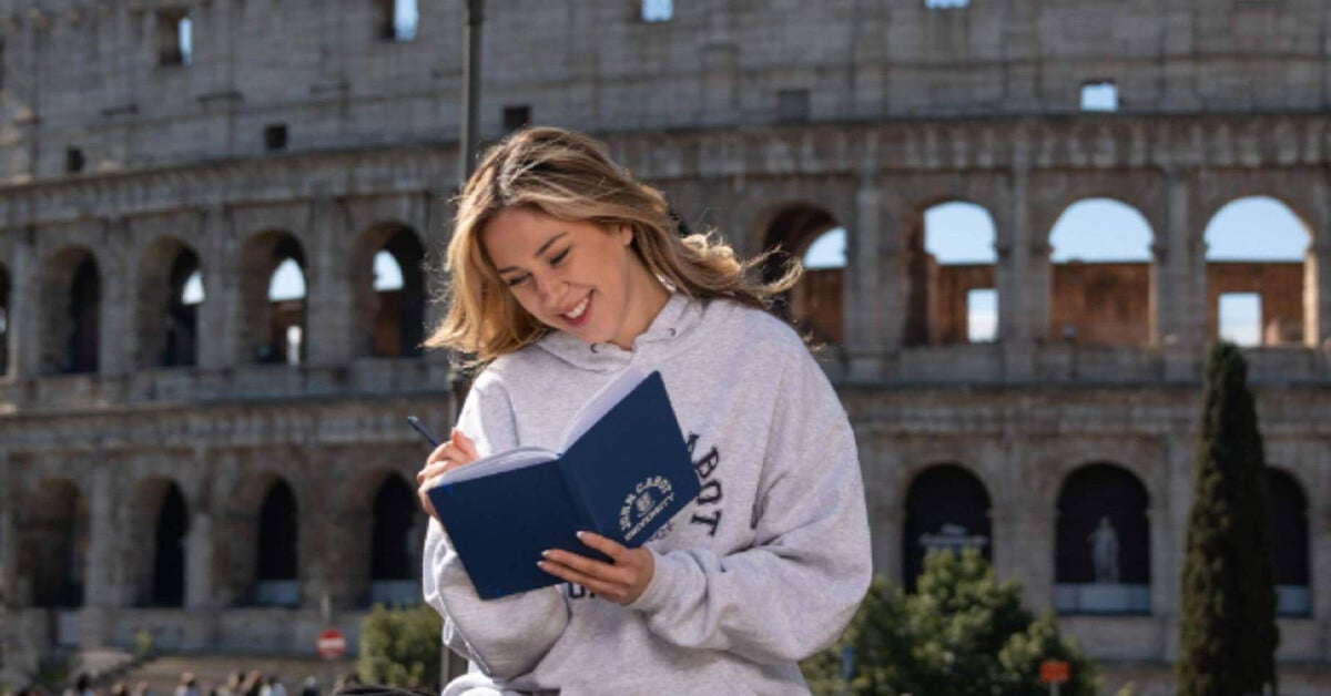 A student taking a summer engineering course studying in front of the Colosseum