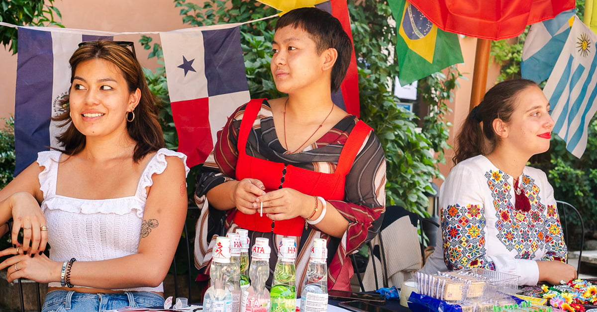 students at a table promoting a club as they study international affairs in Rome