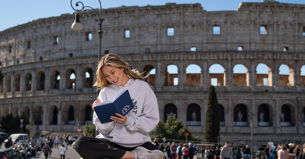 A focused female student going through her notes at our university in Rome