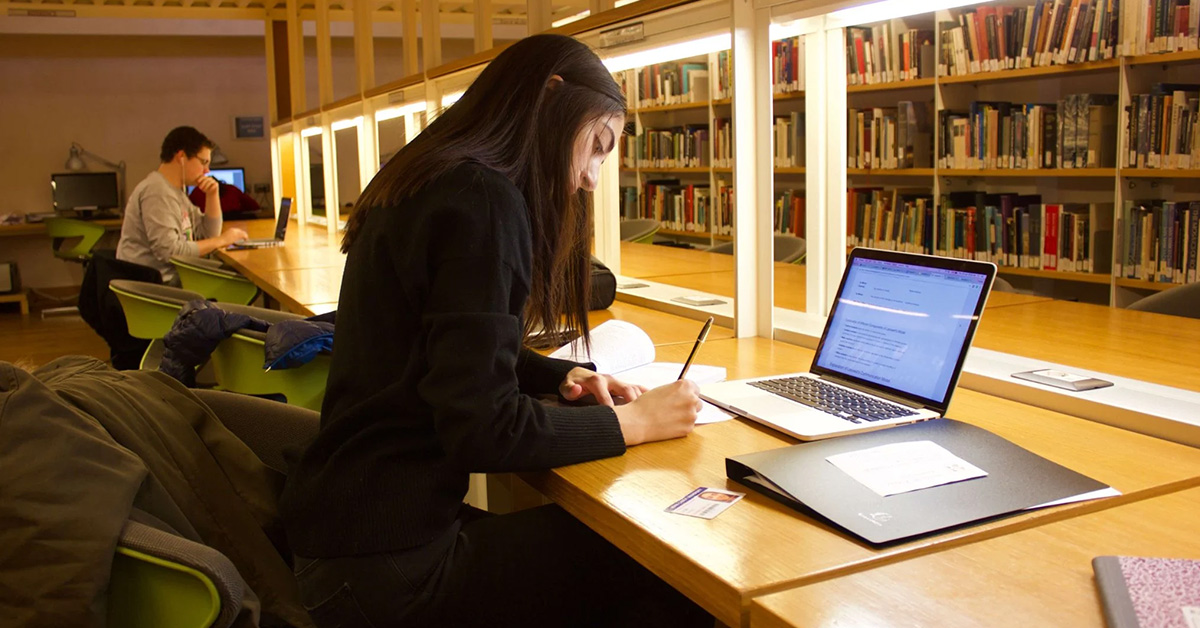 A JCU student studying in the library